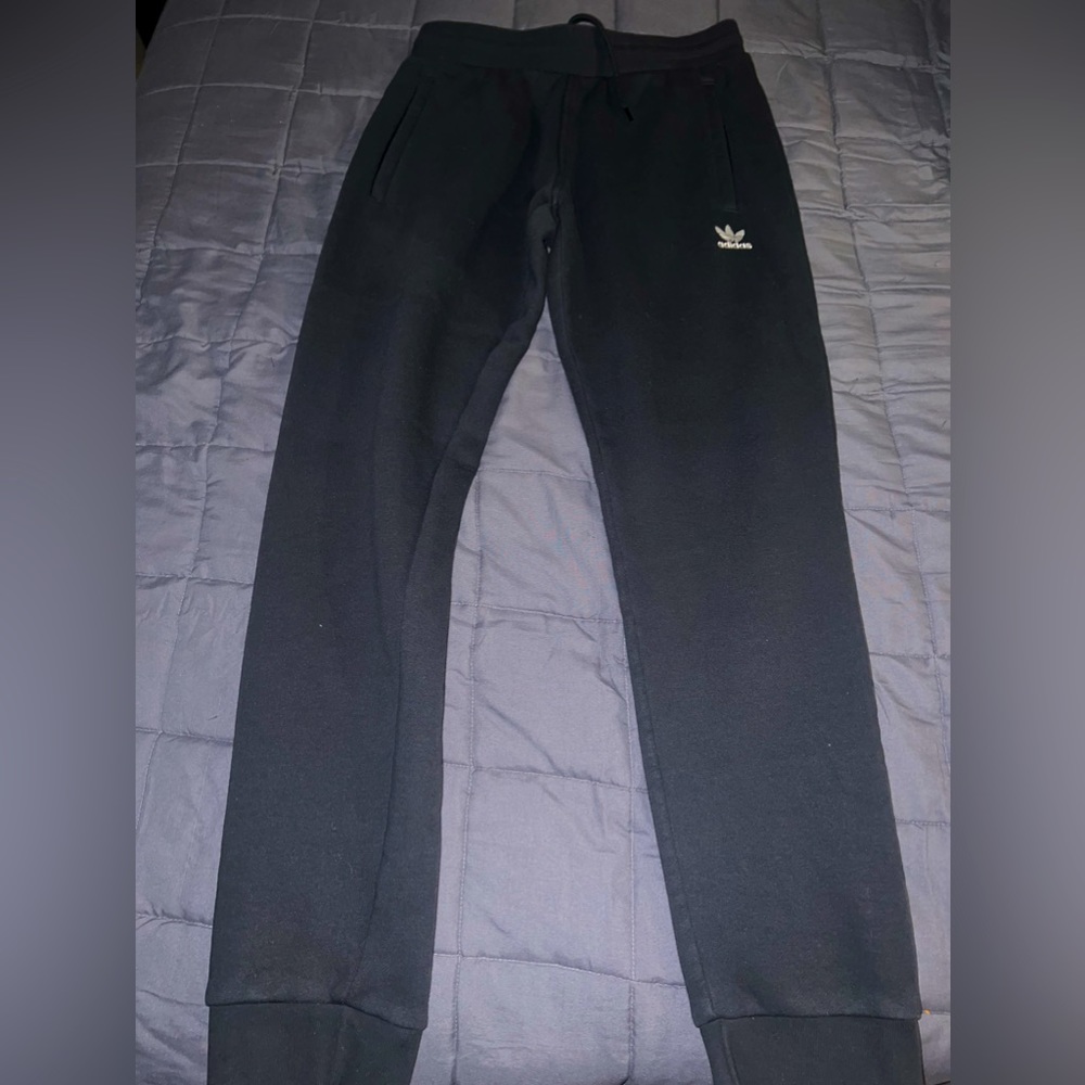 Two Adidas sweatpants one Jordan sweatpants